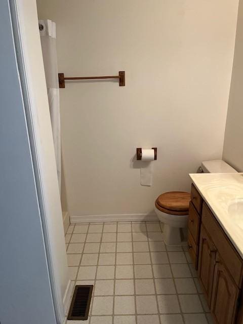 12 Arcot Rd, Celina, TN 38551 - bathroom featuring visible vents, baseboards, toilet, tile patterned floors, and vanity