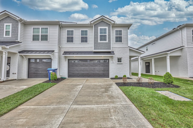 view of front facade featuring a front yard and a garage