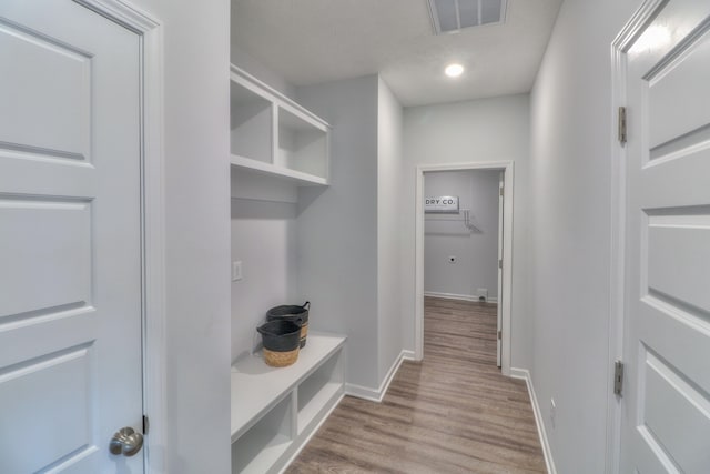 mudroom with hardwood / wood-style flooring