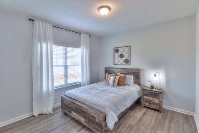 bedroom featuring hardwood / wood-style flooring