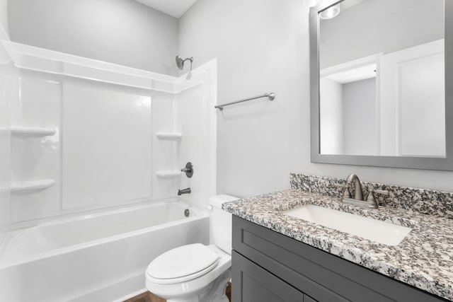 full bathroom with shower / tub combination, vanity, and toilet