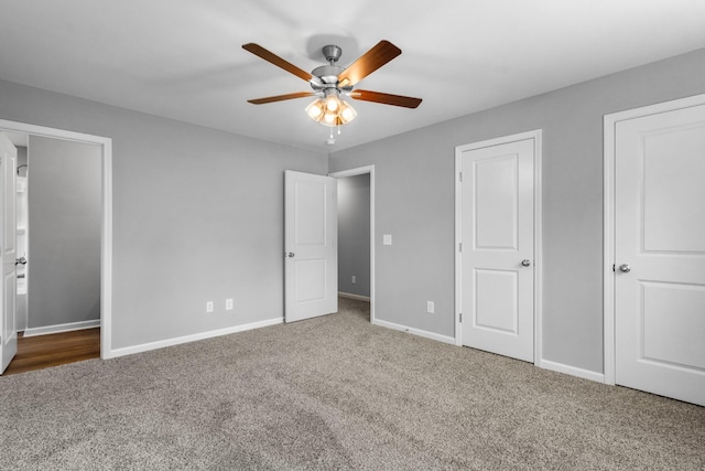 unfurnished bedroom featuring carpet floors and ceiling fan