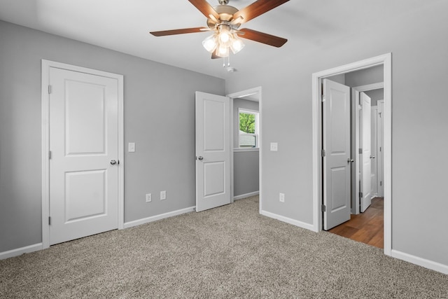 unfurnished bedroom featuring carpet floors and ceiling fan