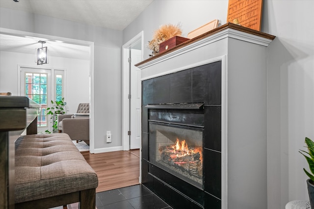 living room with dark tile flooring