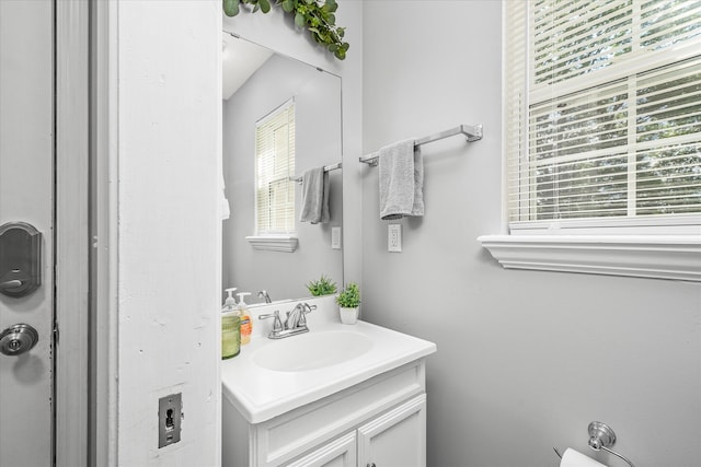 bathroom featuring vanity with extensive cabinet space