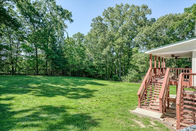 view of yard with ceiling fan