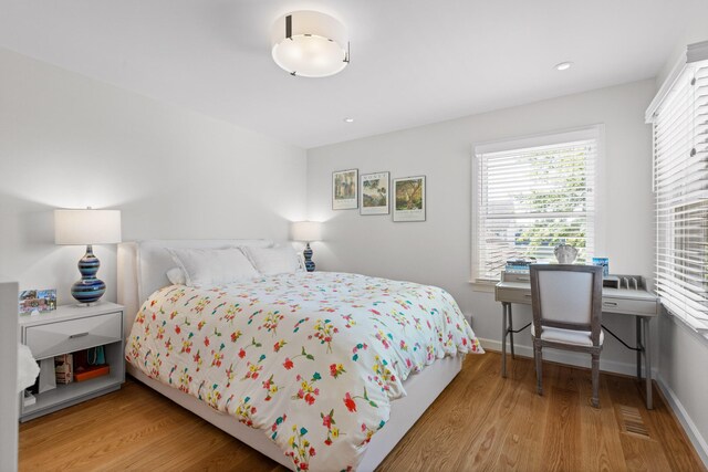 bedroom with light wood-type flooring