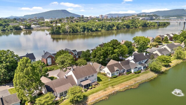 birds eye view of property featuring a water and mountain view