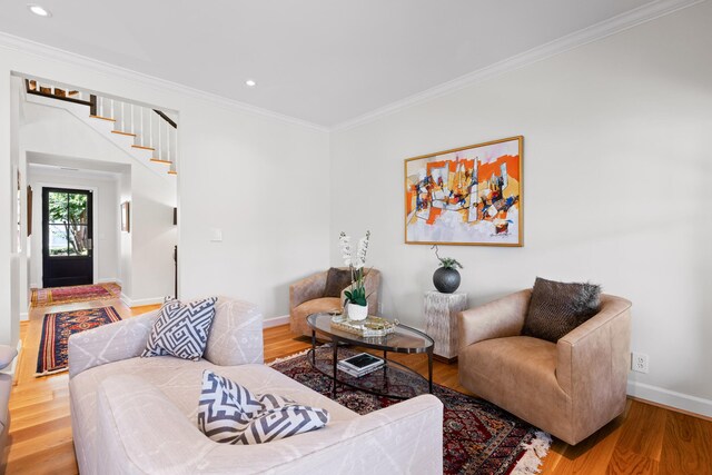 living room featuring ornamental molding and hardwood / wood-style flooring