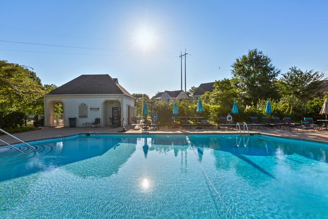 view of swimming pool featuring a patio area