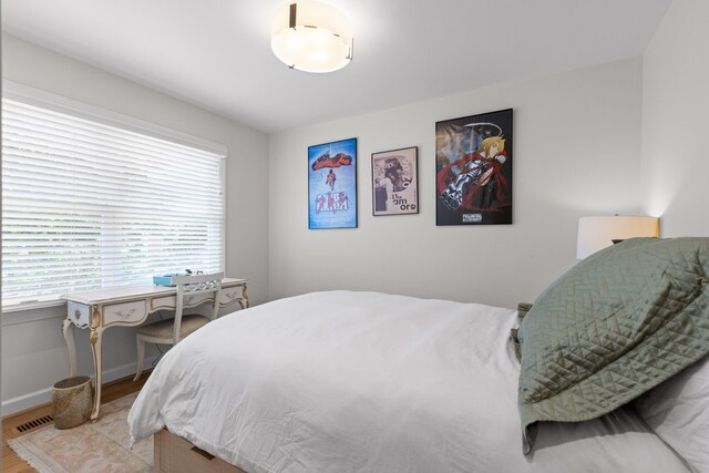 bedroom featuring hardwood / wood-style flooring