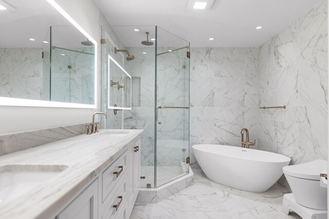 bathroom with tile walls, tile flooring, plus walk in shower, and double sink vanity