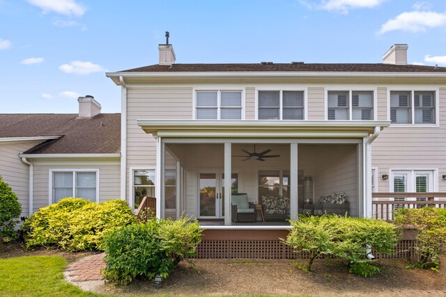 back of property with ceiling fan