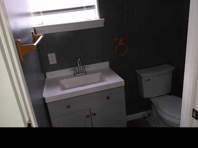 bathroom featuring vanity and toilet