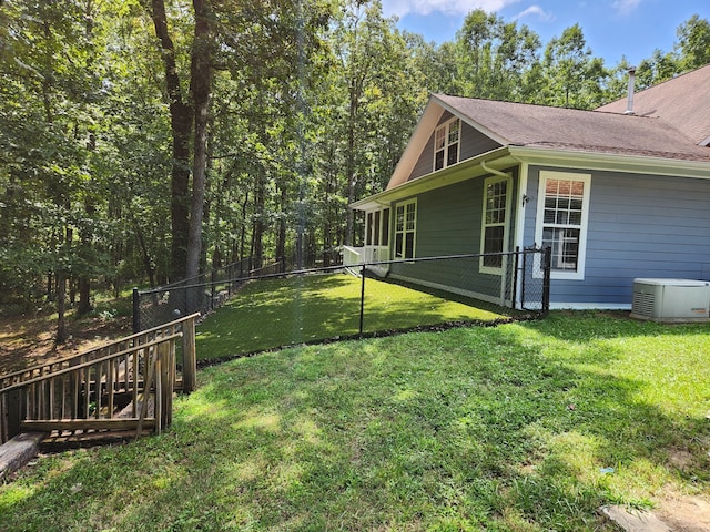 view of yard featuring central AC