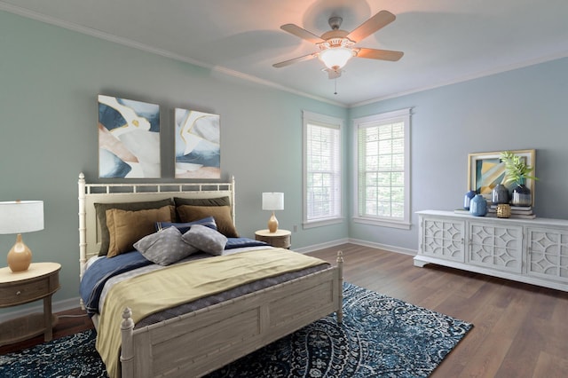 bedroom featuring ornamental molding, ceiling fan, and dark hardwood / wood-style floors