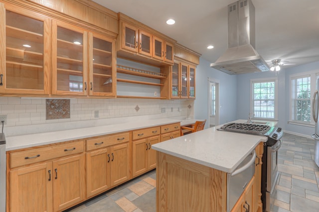 kitchen with island exhaust hood, tasteful backsplash, light tile flooring, and stainless steel range