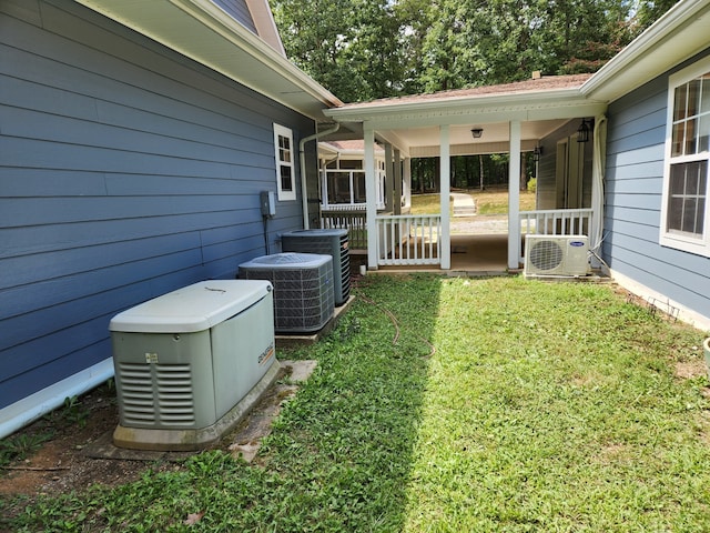 view of yard with central air condition unit