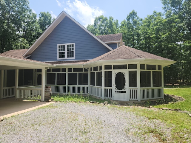 back of house with a sunroom