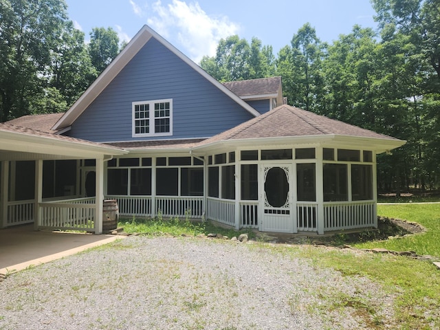 view of front of home with a sunroom