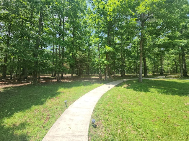 view of home's community featuring a lawn