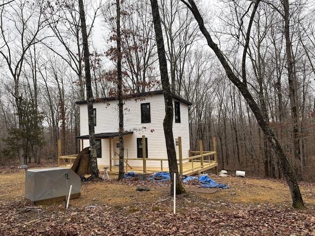 back of house featuring a deck