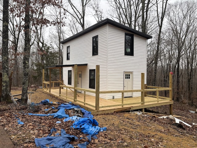 back of property with a deck