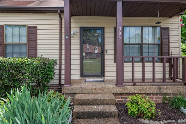 doorway to property featuring a porch