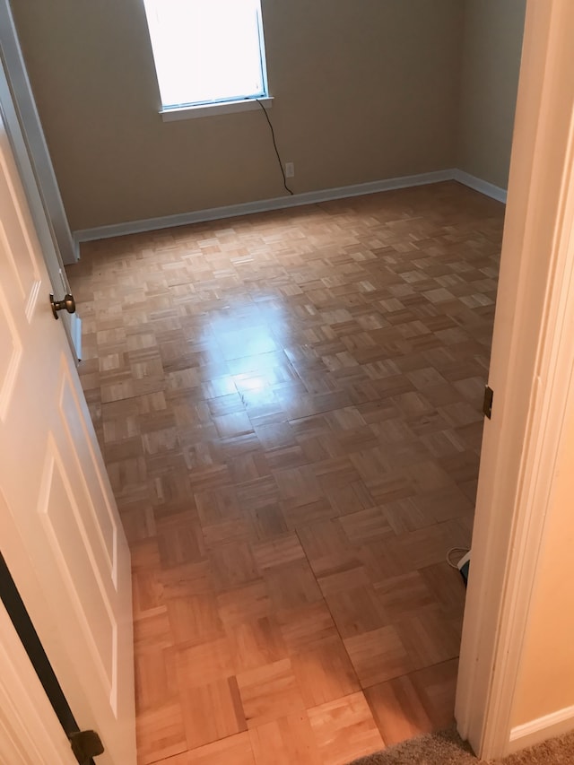 spare room with parquet floors