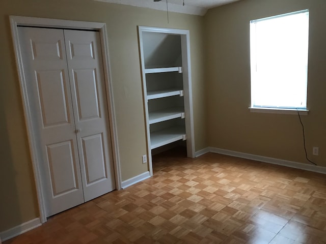 unfurnished bedroom with light parquet floors