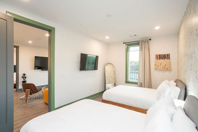 bedroom with wood-type flooring