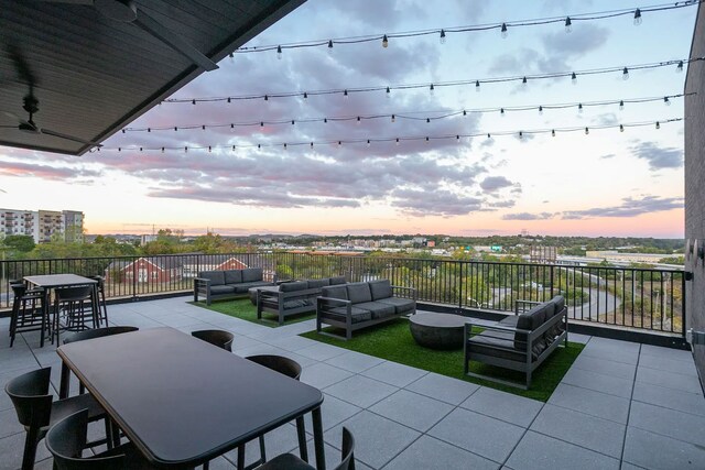 patio terrace at dusk with an outdoor hangout area