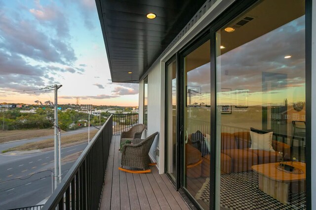 view of balcony at dusk