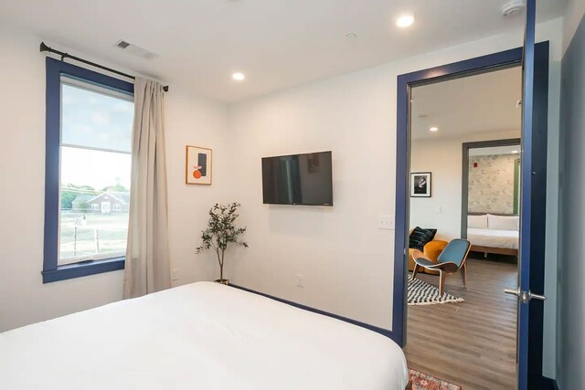 bedroom featuring wood-type flooring