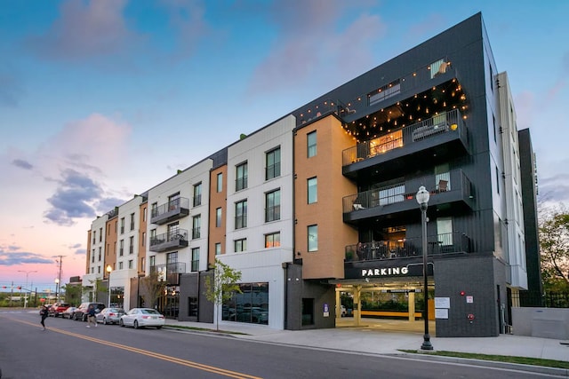 view of outdoor building at dusk