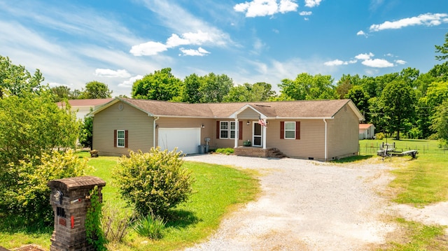 ranch-style home with a garage and a front lawn