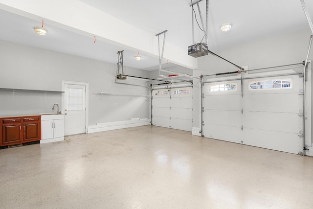 garage with sink and a garage door opener