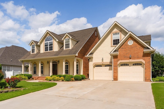 view of front of house with a porch and a garage