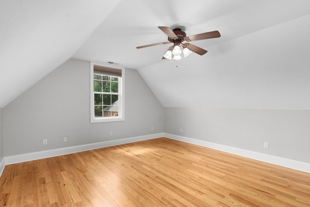 additional living space with ceiling fan, light hardwood / wood-style flooring, and lofted ceiling