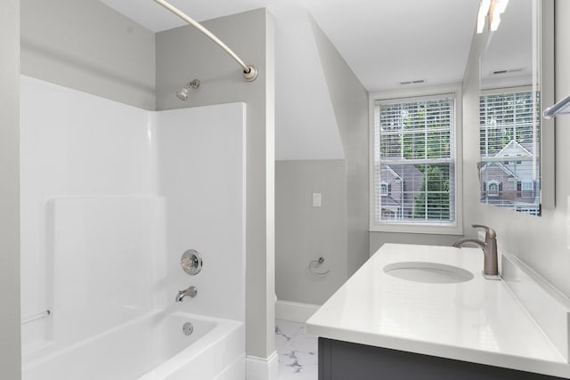 bathroom featuring vanity and shower / tub combination