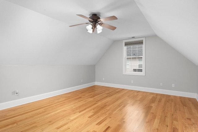 additional living space with light wood-type flooring, ceiling fan, and lofted ceiling