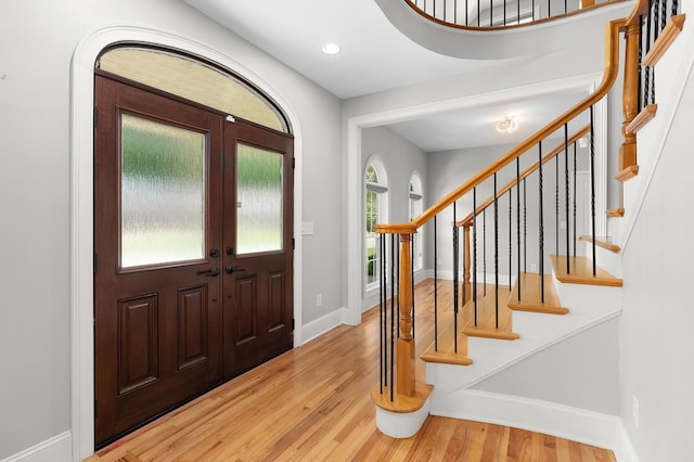 foyer featuring a wealth of natural light and hardwood / wood-style floors