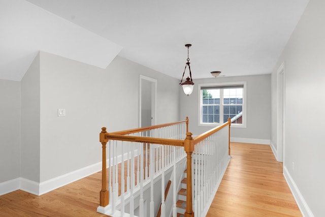 hallway with light hardwood / wood-style flooring