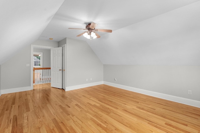 bonus room with light hardwood / wood-style flooring, ceiling fan, and lofted ceiling