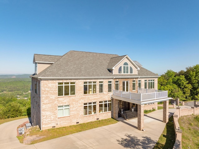 rear view of house with a balcony