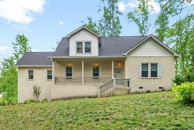 view of front of house featuring a front yard and covered porch