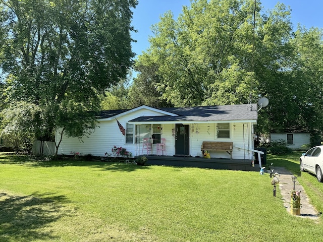 ranch-style house with covered porch and a front yard