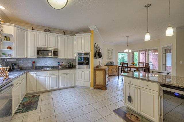 kitchen featuring white cabinetry, stone counters, stainless steel appliances, wine cooler, and pendant lighting