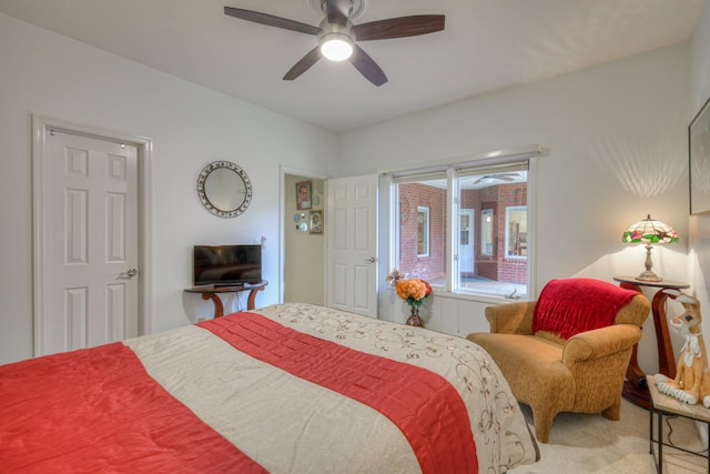 bedroom featuring ceiling fan and carpet