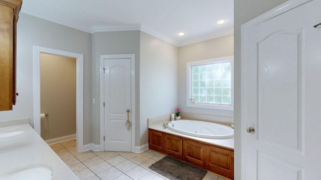 bathroom with vanity, a tub to relax in, tile patterned floors, and crown molding